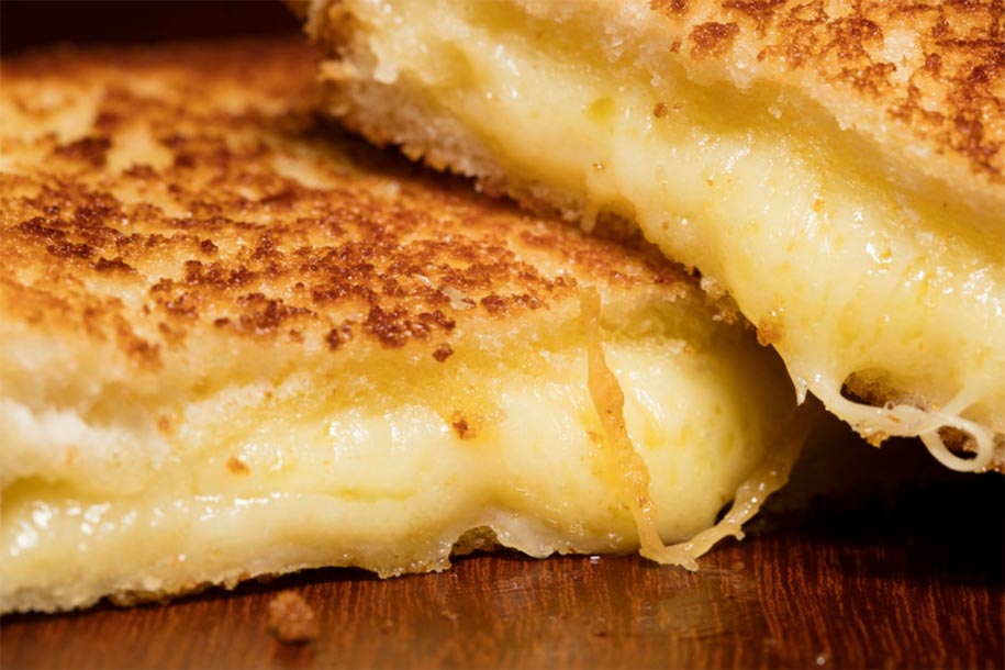 Who Invented Grilled Cheese: Tracing the Origins of a Popular Dish